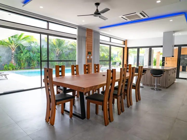 Open-plan dining area overlooking the pool