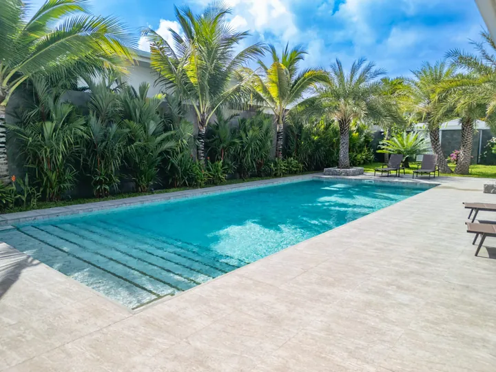 Main pool framed by the tropical garden