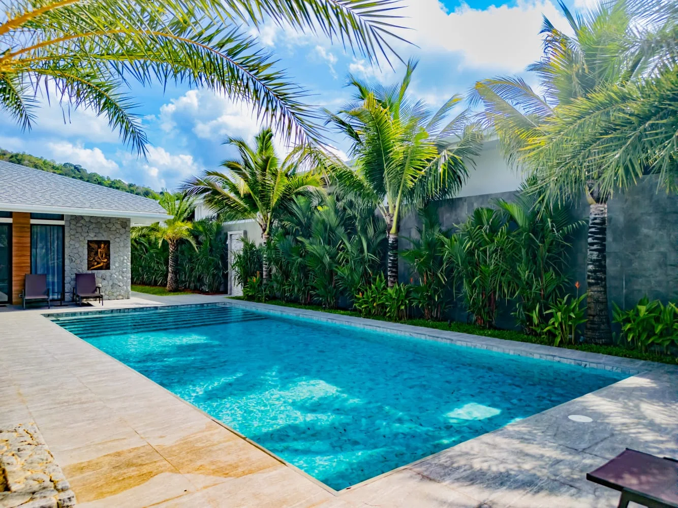 Pool courtyard and tropical façade of Palms Garden Villa